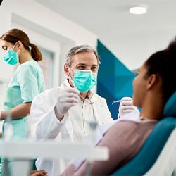 Dentist treats patient