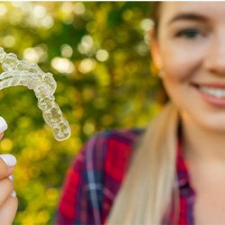 Lady shows off clear aligners