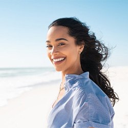 Lady smiles at beach